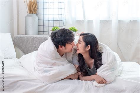 Lovely Asian Couple Covered With White Blanket While Their Noses And