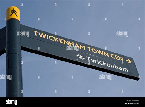 Signpost Giving Directions To Twickenham Town Centre And Train Station