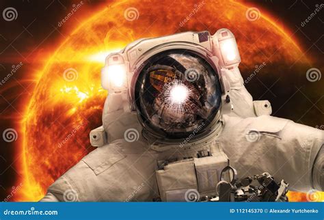 Asrtonaut In The Space On The Orange Giant Star Background Elements Of