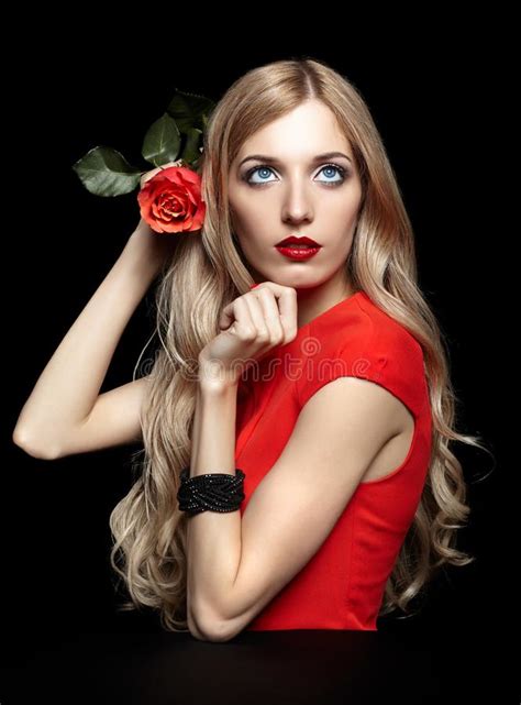 Portrait Of Young Beautiful Blonde Woman In Red Dress With Red R Stock