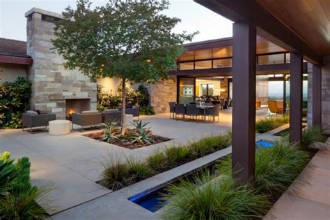 Steal front porch design ideas from these pretty, relaxing homes. Contemporary Courtyard With Outdoor Fireplace | HGTV