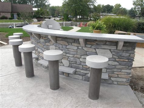 The budget was tight and so casting was out of the question. Outdoor Concrete Bar Top and Stools Made to Weather