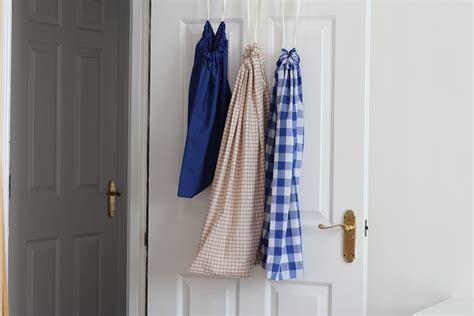 This laundry room has several clever tips you can put to work in your own laundry area. DIY Drawstring Laundry Bag - Greenie Dresses For Less