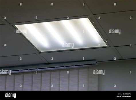 Fluorescent Light On Ceiling In Grey Office Stock Photo Alamy