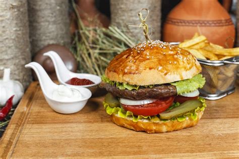 Hamburger With French Fries Ketchup And Creamy Sauce In Oriental Style