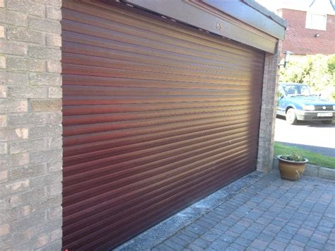 Factory roller door entrance, floor building store shop interior. Roller Garage Doors North West | Roller Garage Door ...