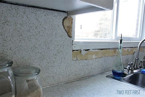 We installed ours behind, so we could replace the counters later, but it could also be placed on top. Removing Laminate Backsplash