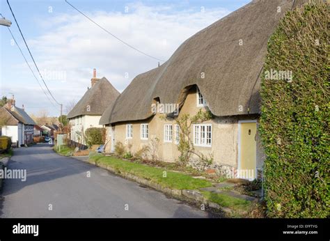 Thatched Cottages In The Wiltshire Village Of Enford Stock Photo Alamy