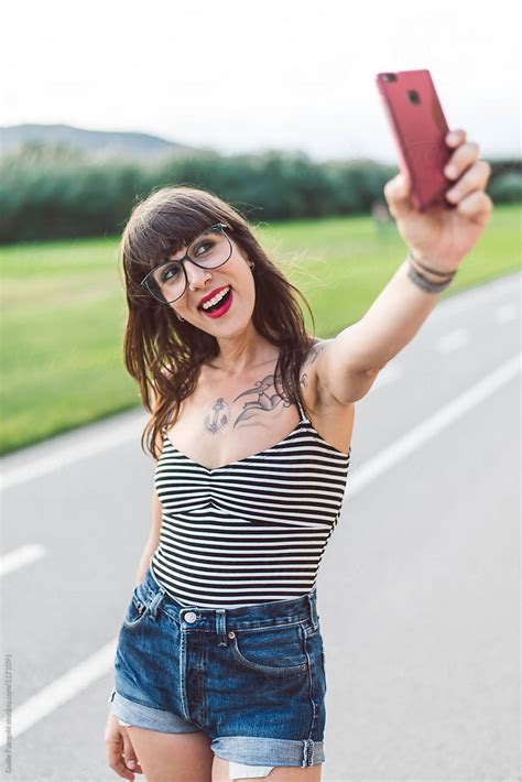 Tattooed Girl Taking Selfie By Stocksy Contributor Guille Faingold Stocksy
