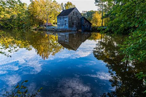 Historic Yates Grist Mill Reflecting On Yates Mill Pond Stock Image