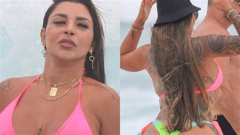 Jenny Miranda causa alvoroço ao usar biquíni fio dental em praia do Rio de Janeiro