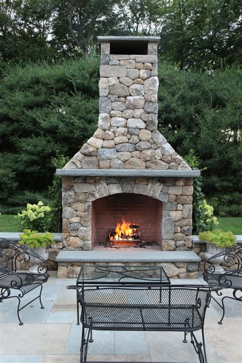 Custom built fireplaces are more expensive and designed from the ground up, but additionally, your outdoor fireplace should have a convenient storage area for wood or propane. Outdoor Fireplace Built Freddys Landscape Company In ...