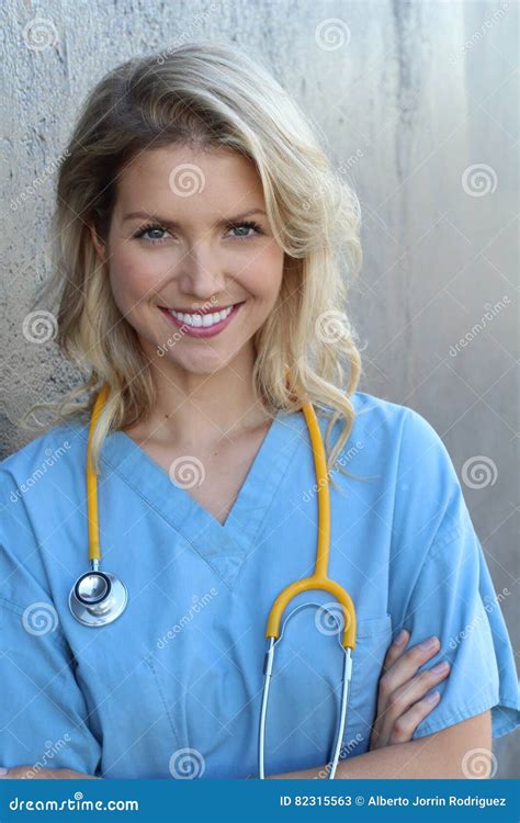 Nurse With Long Blonde Hair And A Stethoscope In A Uniform Smiling At The Camera Stock Image