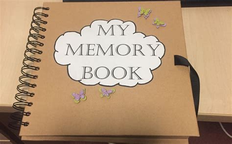 A Book With The Words My Memory Book Written On It And Butterflies
