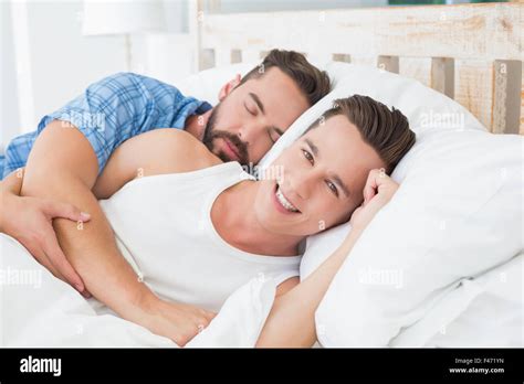 Homosexual Couple Lying On Bed Stock Photo Alamy