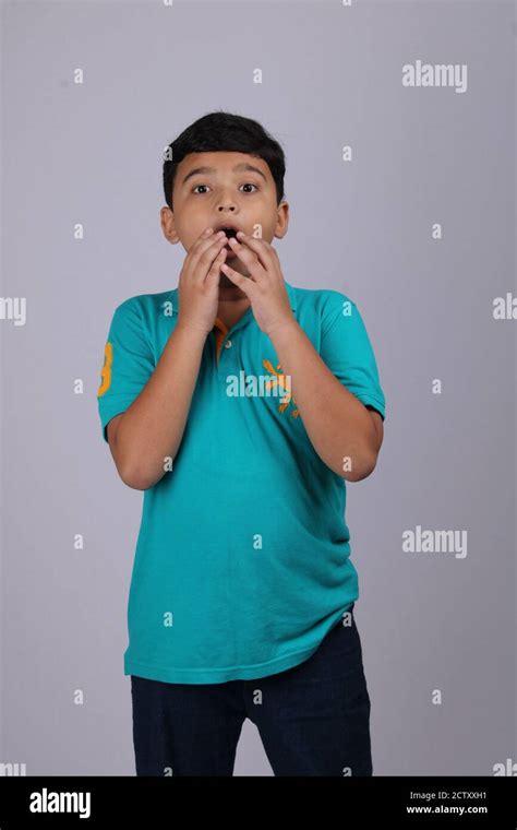 Boy With A Shocked Face Expression Isolated Over White Background