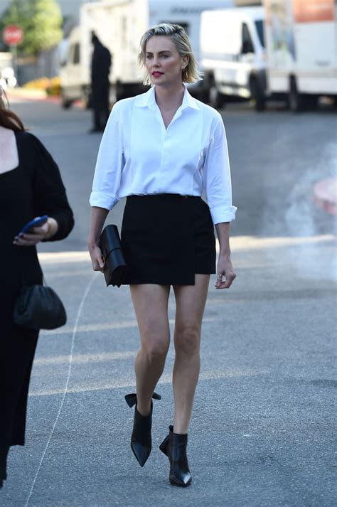 Charlize Theron 45 Stuns In Black Mini Skirt And Sexy Red Lip As She