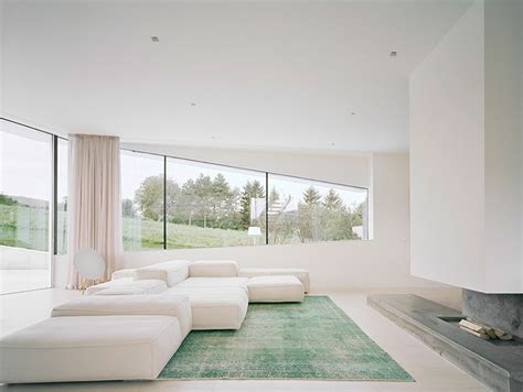 Interior of an entrance of a modern house design. Freundorf Residence: Futuristic all-white house near ...