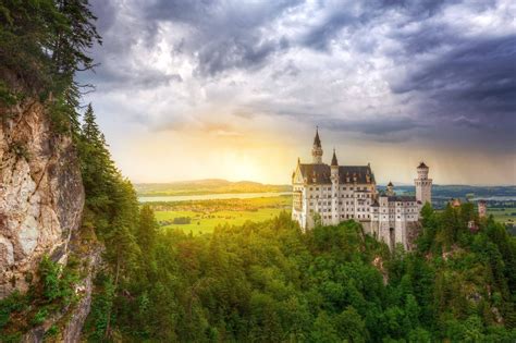 Neuschwanstein Castle In The Bavarian Alps At Sunset Germany With