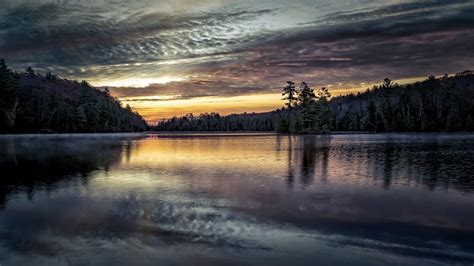 1920x1080 A Calm Lake At Sunset 1080p Laptop Full Hd Wallpaper Hd