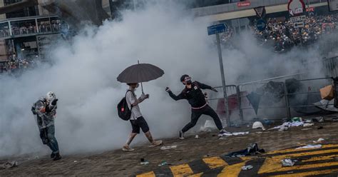 Bricks Bottles And Tear Gas Protesters And Police Battle In Hong Kong