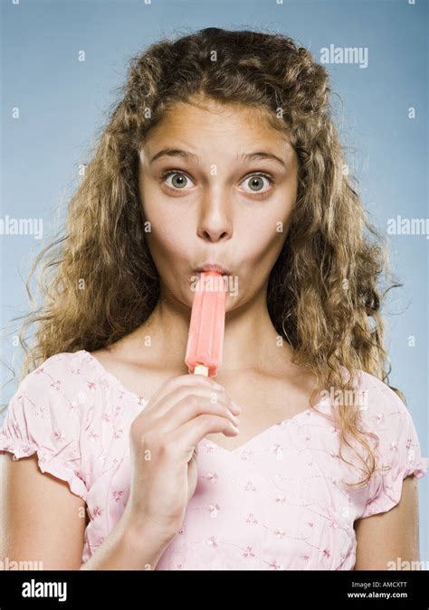 Girl Eating Popsicle Stock Photo Alamy