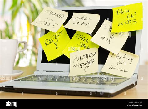 Laptop Screen Covered With Sticky Notes With Different Appointments On