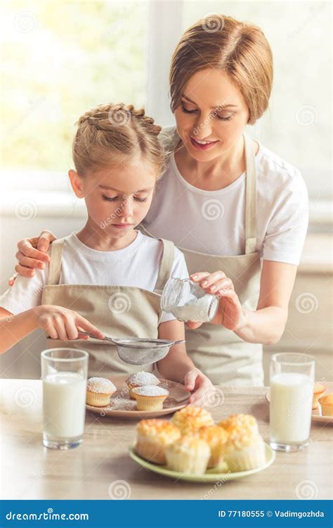 Mother And Daughter In The Kitchen Stock Image Image Of Dredg Dusk 77180555
