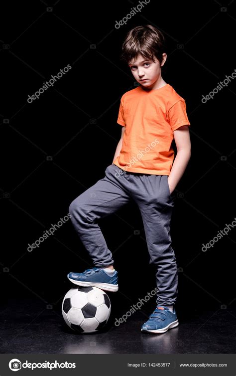 Boy With Football Ball Stock Photo By ©arturverkhovetskiy 142453577