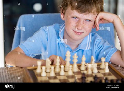 Boy Playing Chess Stock Photo Alamy