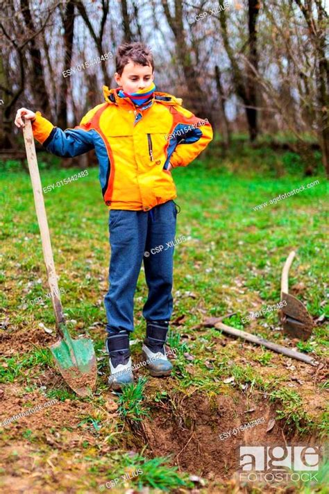 Boy Digging In The Ground Stock Photo Picture And Low Budget Royalty