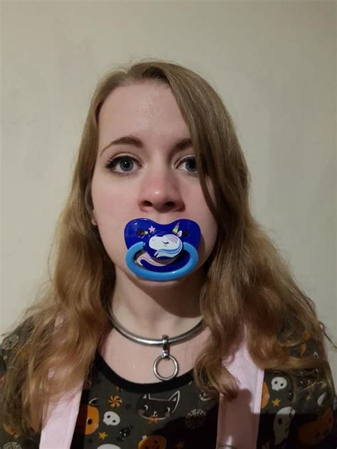 A Woman With A Pacifier In Her Mouth