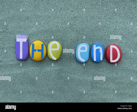 The End Creative Text Composed With Multi Colored Stone Letters Over