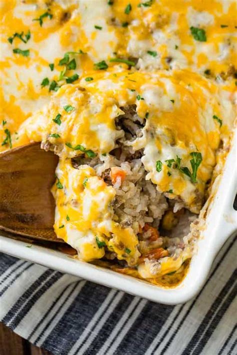 In a medium bowl, combine cream of chicken soup, nacho cheese soup, diced tomatoes, milk, and crushed red pepper. Cheesy Ground Beef And Rice Casserole - Lil Moo Creations