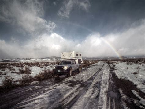 Four wheel pop-up truck camper in snow with rainbow. | Pop ...