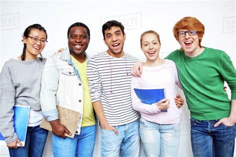 Portrait Of Happy College Students Standing Together Stock Photo