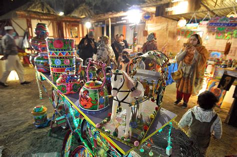 People Visiting Different Stalls During Folk Festival Lok Mela At Lok