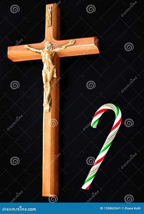 Closeup Of Jesus Christ Crucified With Candy Cane On Solid Black
