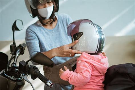 Wear A Helmet For The Safety Of Young Children Before Going Out Stock