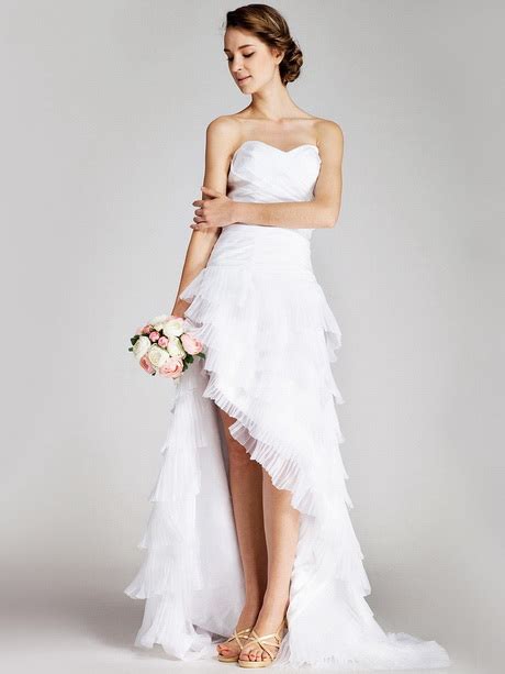 So grab your coconut drink and head on over to the full gallery for more amazing ideas on how to style your own island paradise. Tropical wedding dresses