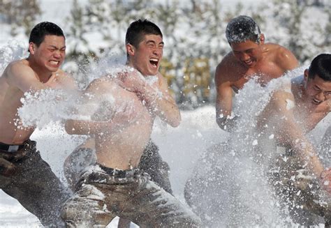 Chinese Soldiers Trained With Swords In The Snow Near The Countrys