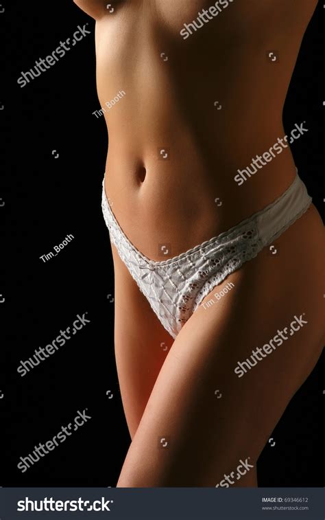 Naked Womans Torso Wearing White Knickers Stock Photo