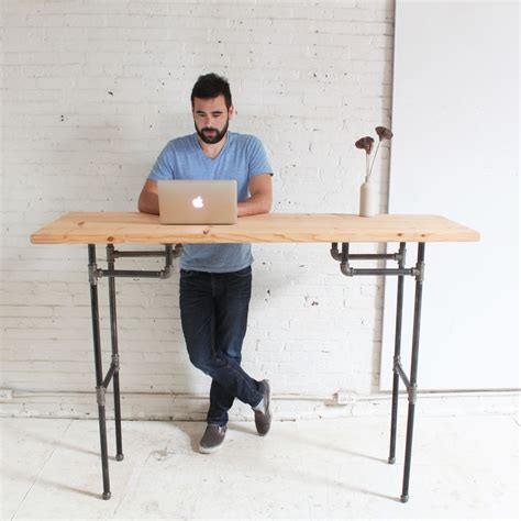 You don't need to plug it in or rely on electricity, so it frees up an outlet. DIY Plumbers Pipe Standing Desk