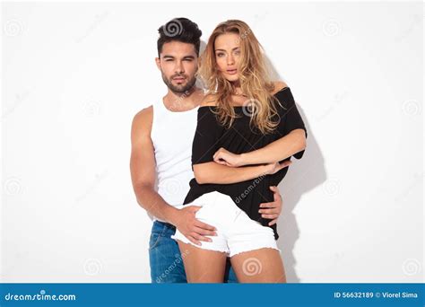 Young Man Holding His Girlfriend From Behind Stock Image Image Of Male Undershirt 56632189