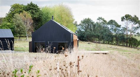 A modern family house house outside martinstown ballymena. Modern Barn Form - Innovative Black Barn by Red Architecture