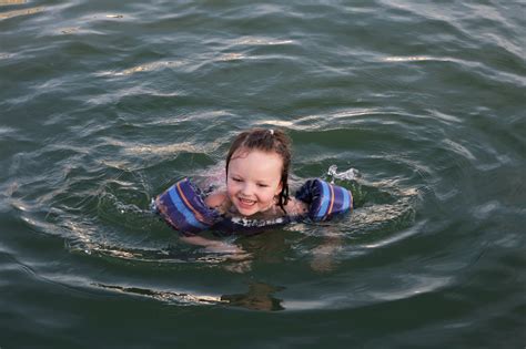 Little Girl Swimming In Lake Free Stock Photo Public Domain Pictures