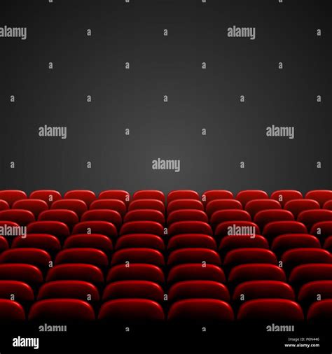 Rows Of Red Cinema Or Theater Seats In Front Of Black Blank Screen