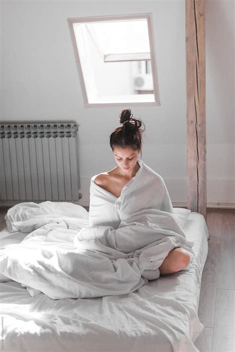 Portrait Of Beautiful Woman Who Sitting On Bed By Katarina Simovic