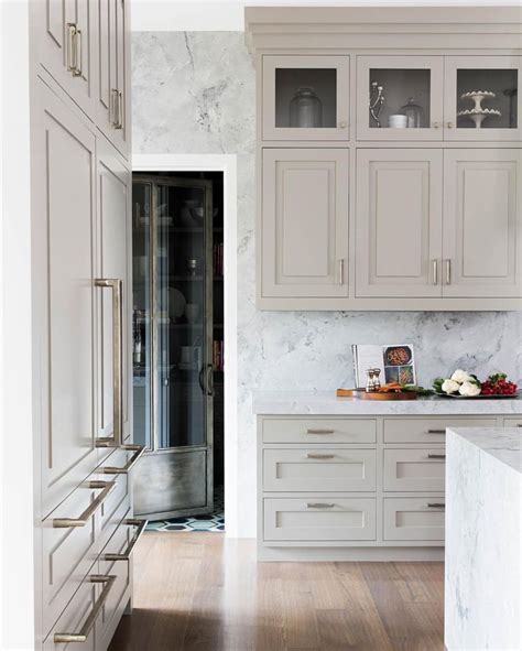 See more of kz kitchen cabinet & stone inc. Marble waterfall countertop with beige kitchen cabinets ...