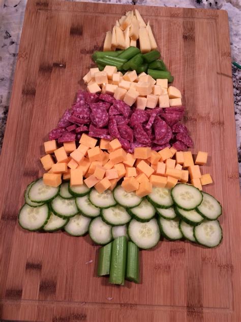 These unique christmas tree food ideas are the perfect recipe for a festive and fun party! Christmas Tree-shaped veggie, cheese, and meat platter | Holiday appetizers easy, Holiday ...